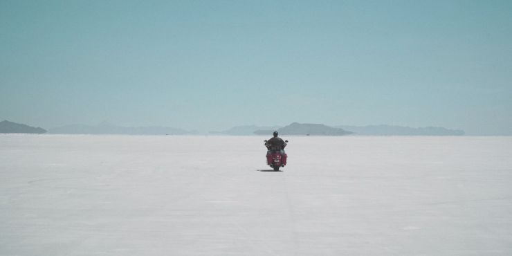 Man Riding Harley Davidson Motorcycle In Cold Weather