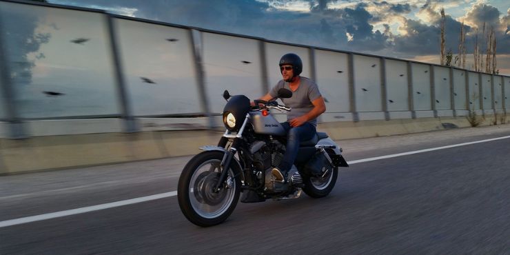 How Fast Is A Harley Davidson - Harley Rider Using One Hand Riding His Motorcycle On The Road