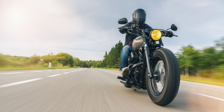 Professional Rider Driving A Harley-Davidson Motorcycle Miles Away