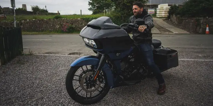 Happy Professional Rider Sitting In A Harley Davidson Street Glide Bike