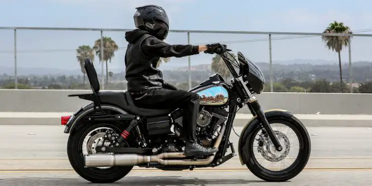 Professional Rider Driving A Dyna Harley-Davidson Motorcycle On The Road