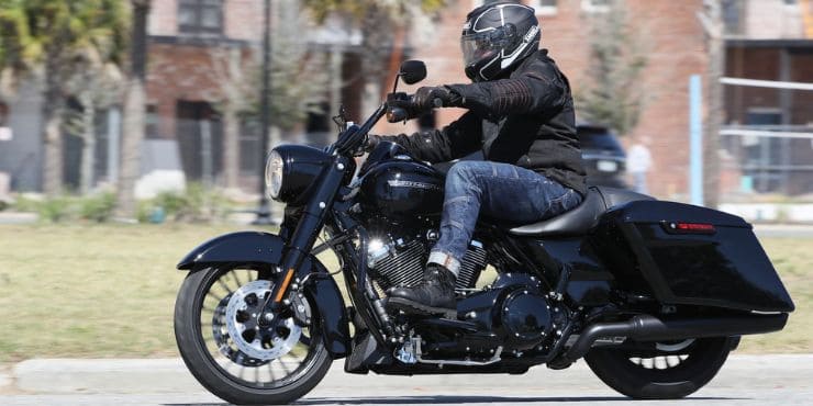 How Much Does A Road King Weight - Man With Gears Riding In Road King Bike