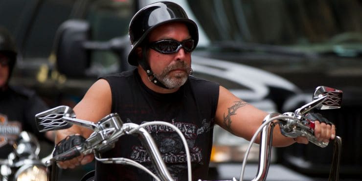 Cool Adult Man Riding In A Harley Davidson Motorcycle