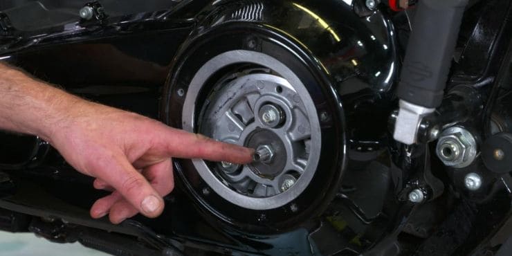 Person Pointing On Harley Bike Clutch