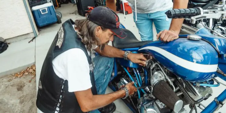 Person Checking Harley Carburetor