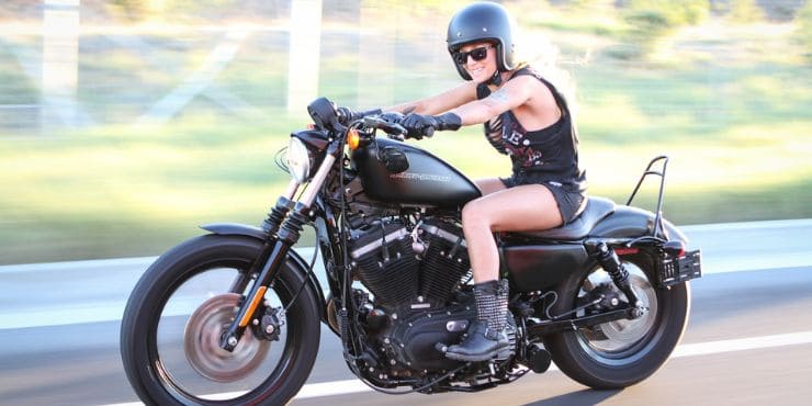 How To Lower A Harley-Davidson Sportster 2 Professional Woman Rider Driving A Harley-Davidson Sportster Fast With Lowered Seat