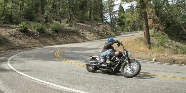 Motorcycle Rider Riding Dyna Bike In Road