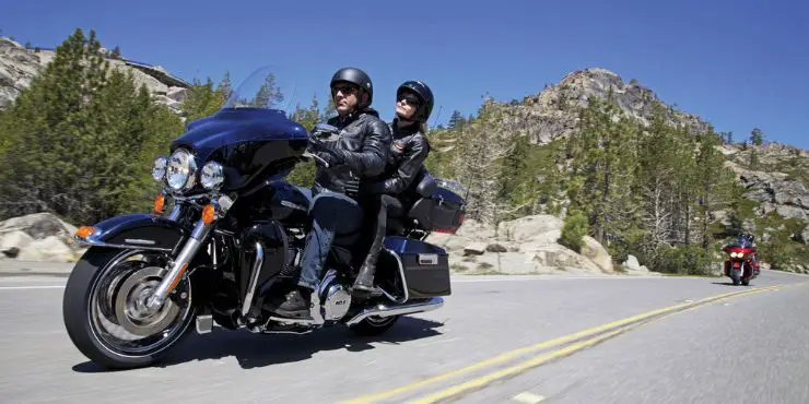 Couple Rider Riding The Harley-Davidson Ultra-Classic Electra