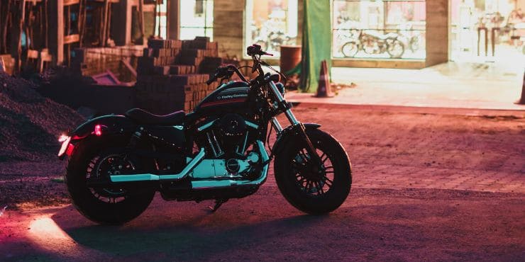 Harley Davidson Bike Parked Beside A Store