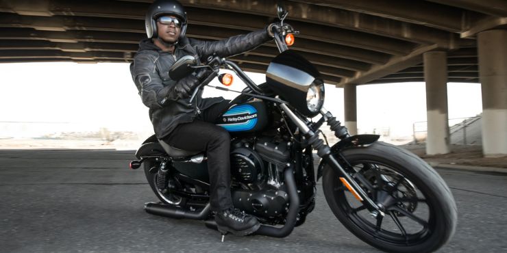 professional rider driving a Harley-Davidson softail motorcycle