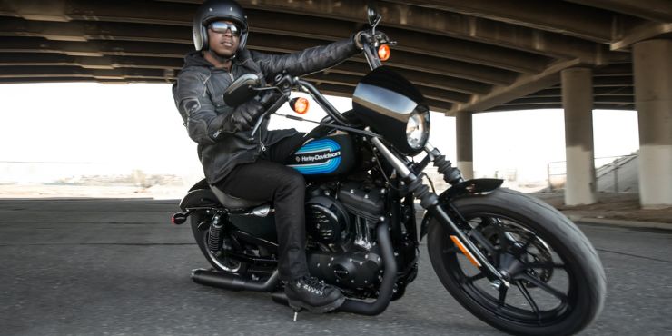 Professional Rider Driving A Harley-Davidson Softail Motorcycle