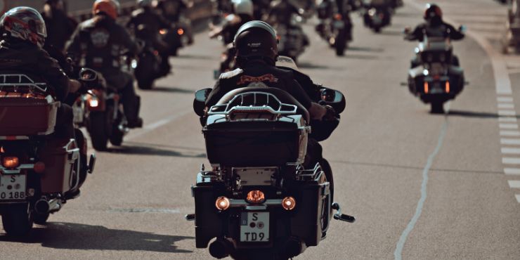 Group Of Riders Riding A Harley-Davidson Bike