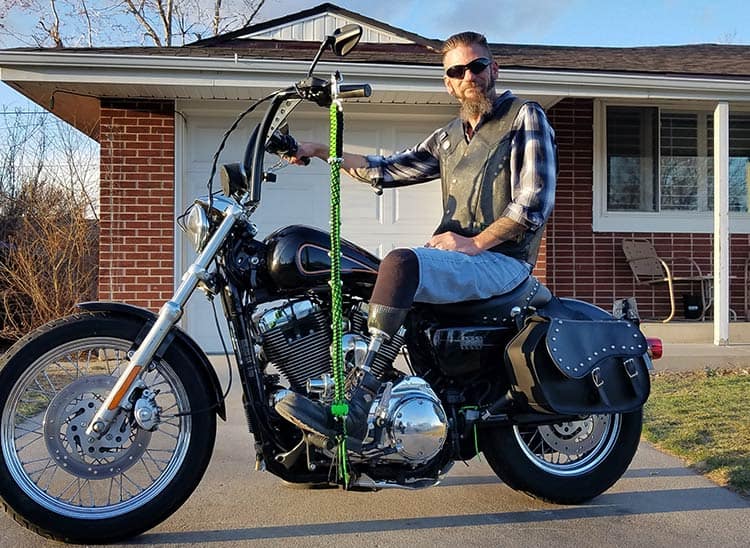 What States Are Get Back Whips Illegal In - Rider Posing With Get Back Whips On Motorcycle