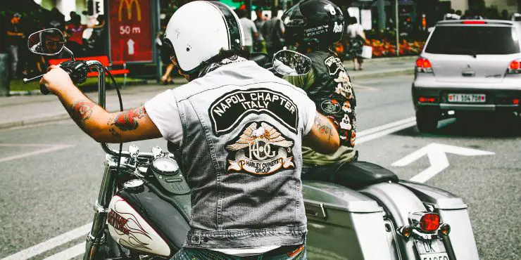 Person Wearing Motorcycle Gear, White Helmet And Jacket, Riding Harley-Davidson Bike 