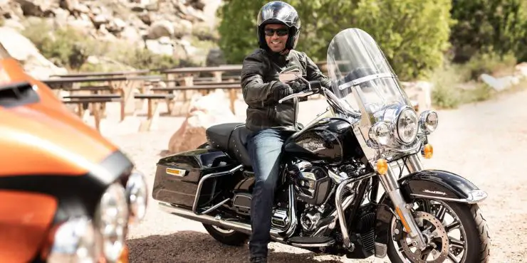 Happy Rider Driving A Harley-Davidson Road King Motorcycle